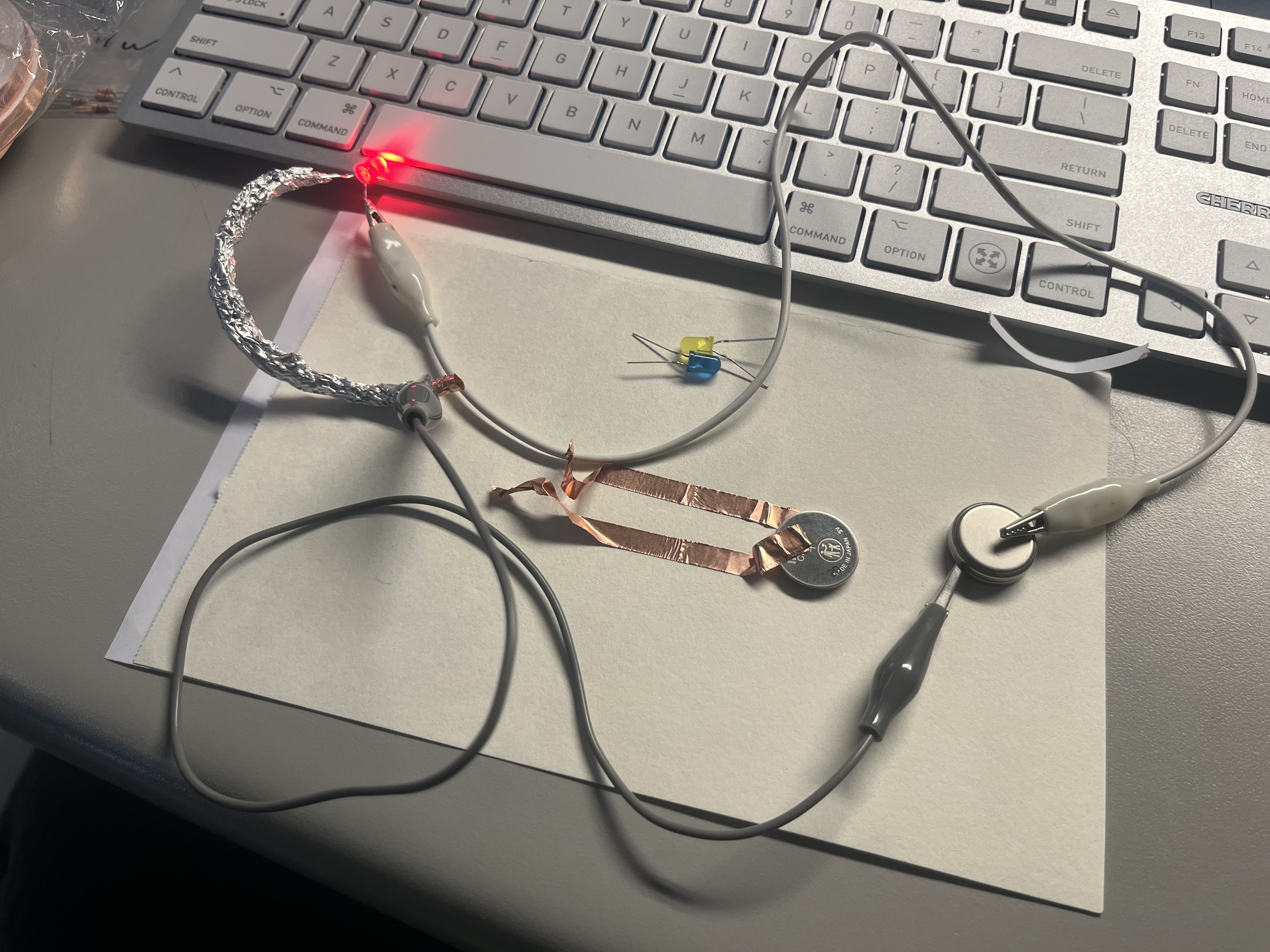 Constructing a series circuit using aluminum foil as a conductor with dual battery input.