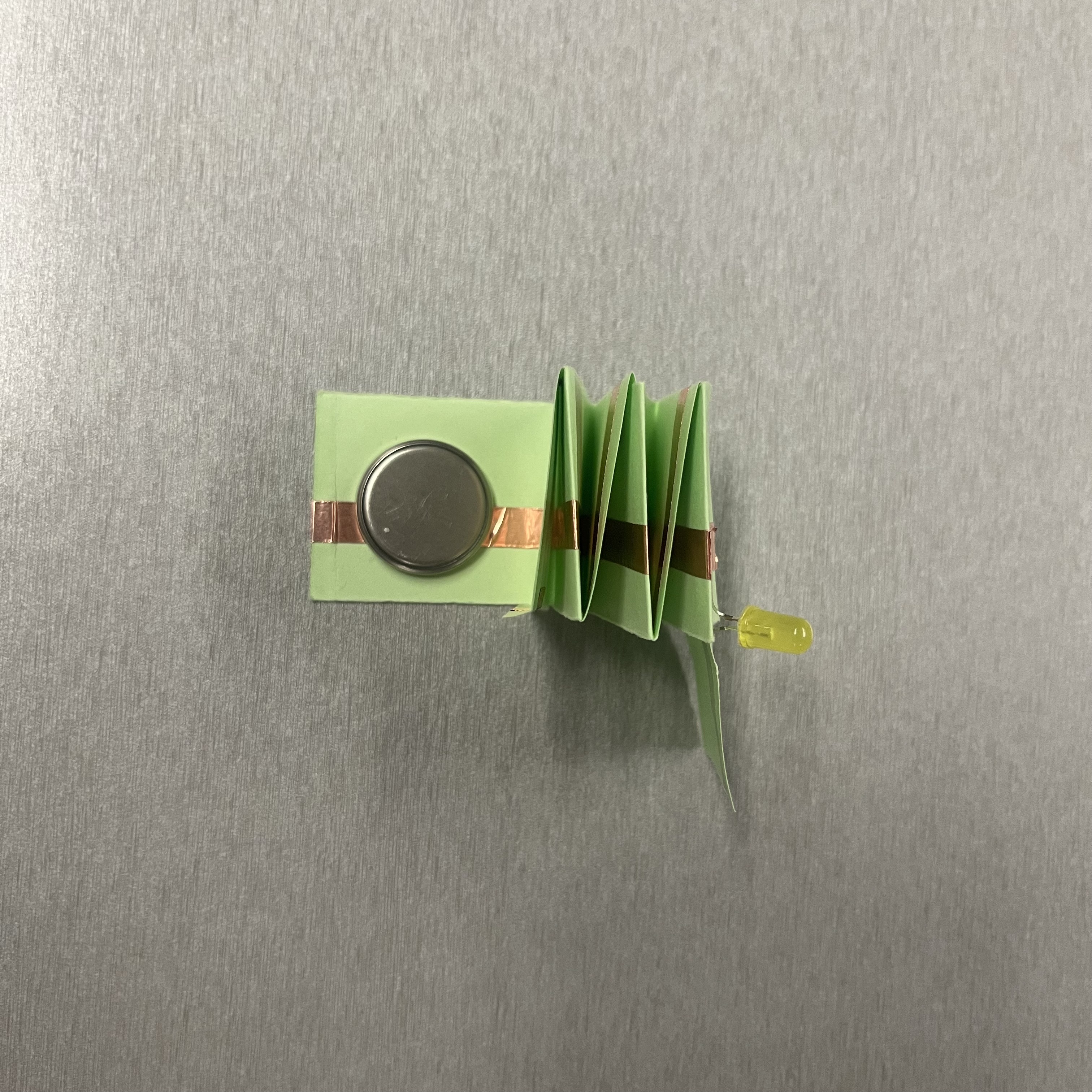 Analyzing the structural composition of the paper spring circuit system.
